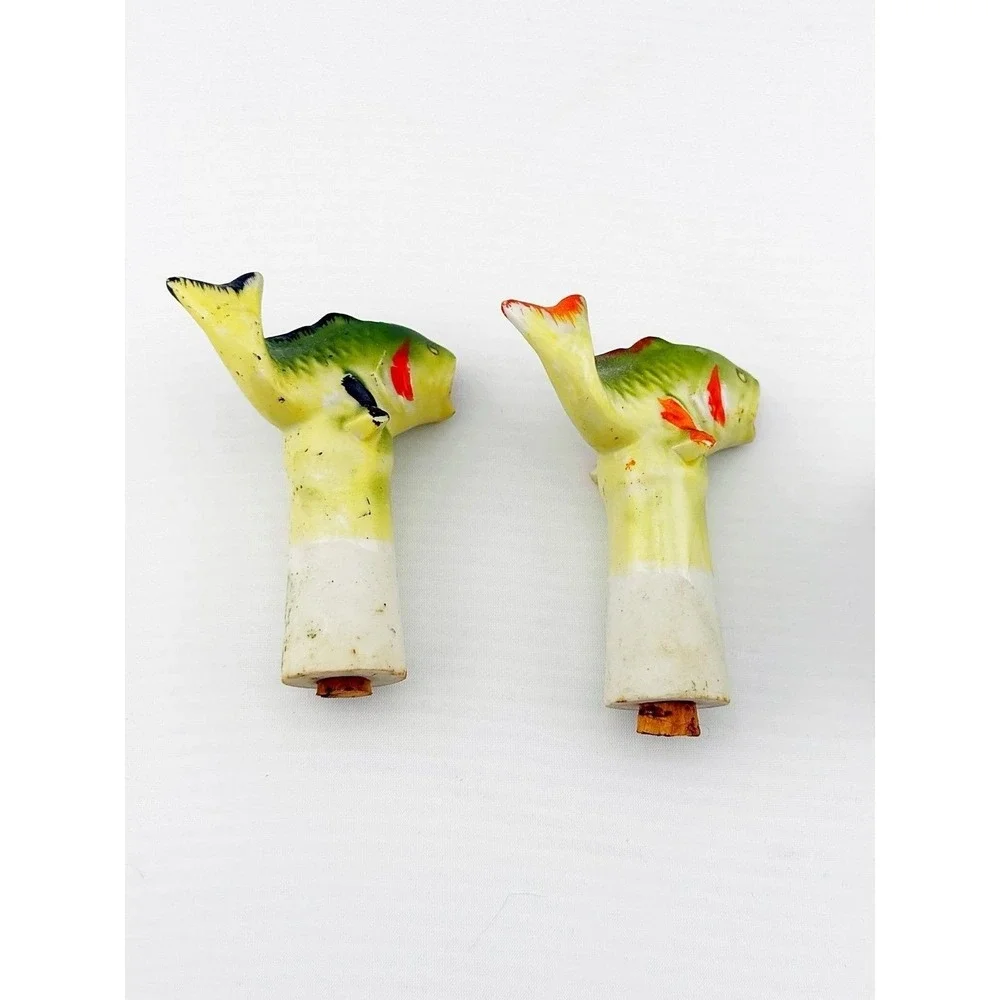 Vintage Japanese porcelain nodder fish salt & pepper shakers with a floral base